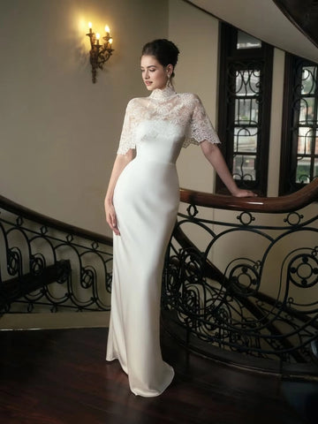 Ivory sheath wedding guest dress with high neck lace cape and floor-length skirt by Vedress