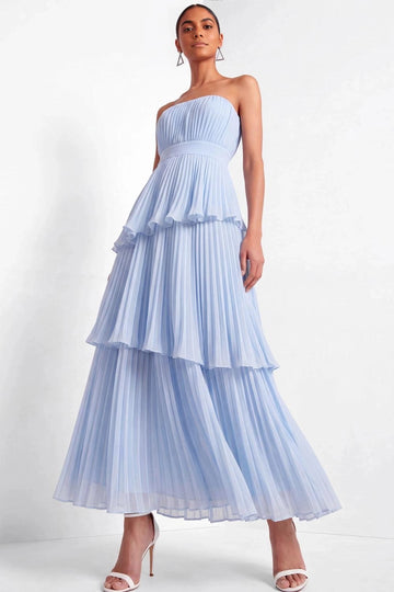 Light blue A-line bridesmaid dress featuring a strapless pleated bodice, fitted waistband, and flowing three-tiered pleated maxi skirt by Vedress.