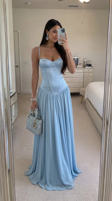 Light blue A-line prom dress with sweetheart neckline, spaghetti straps, corset-style bodice, pointed dropped waist, and flowing floor-length skirt by Vedress.