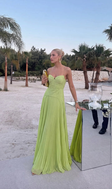 Lime green A-line prom dress with sweetheart neckline, spaghetti straps, pleated bust, fitted dropped waist, and flowing floor-length pleated skirt by Vedress.