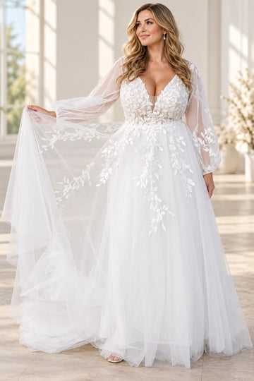 Vedress A-line tulle wedding dress with a plunging V-neck, botanical lace appliques and sheer long bishop sleeves, front view.