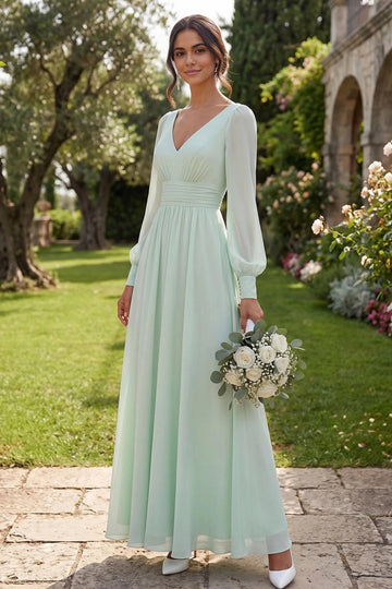 Mint green A-line bridesmaid dress with V-neckline, sheer-look long bishop sleeves, ruched waistband, and flowing floor-length skirt by Vedress.