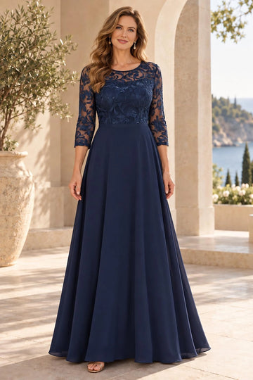 Navy blue A-line mother of the bride dress with sheer illusion round neckline, floral lace bodice, three-quarter lace sleeves and floor-length skirt