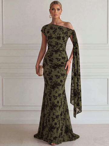 Olive green floral mermaid wedding guest dress with asymmetric neckline, single cap sleeve, ruched waist and flowing shoulder sash.
