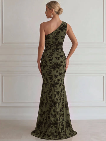 Olive green one-shoulder mermaid evening gown with black floral pattern, asymmetrical back neckline, center zipper closure and fitted flared skirt, back view.