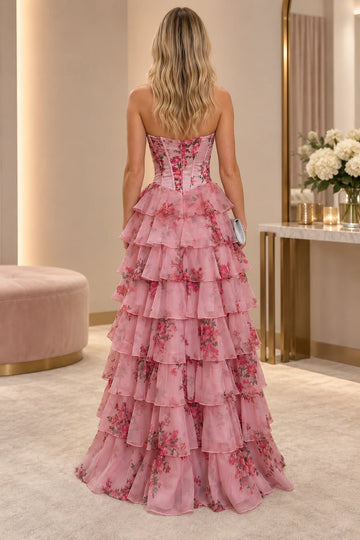 Back of Vedress pink floral prom dress showing a fitted strapless bodice, center-back zipper and floor-length tiered ruffle skirt.