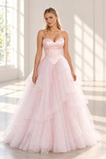Front view of a Vedress pink wedding dress with a strapless satin sweetheart bodice, pointed basque waist and layered tulle ball-gown skirt.