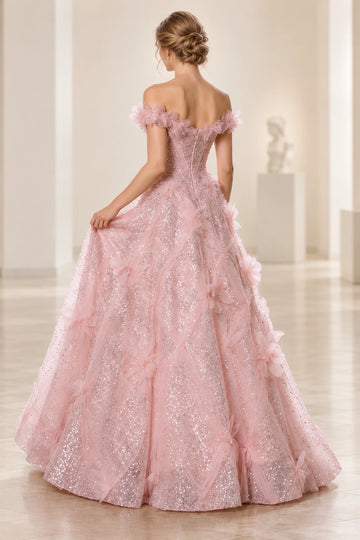 Back view of a Vedress pink floral prom dress with off-the-shoulder bands, a center-back zipper and a full sequin skirt with draped tulle.