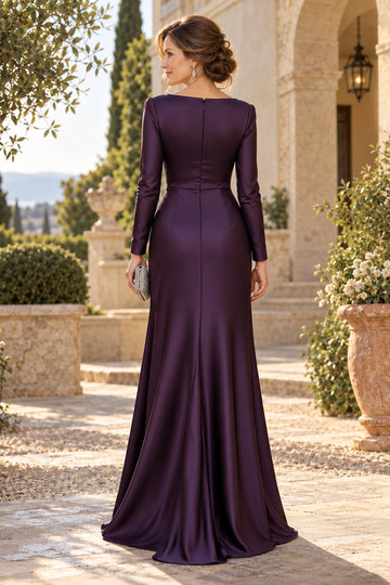 Plum mother of the bride mermaid gown featuring a closed boat neckline, fitted long sleeves, center-back zipper and flowing floor-length flared skirt.