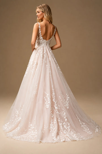 Back view of floral tulle wedding dress with low V back and fabric-covered buttons
