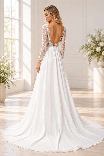 Back view of Vedress wedding dress with a deep U-shaped open back framed by lace, fitted sheer sleeves and a sweeping plain train.