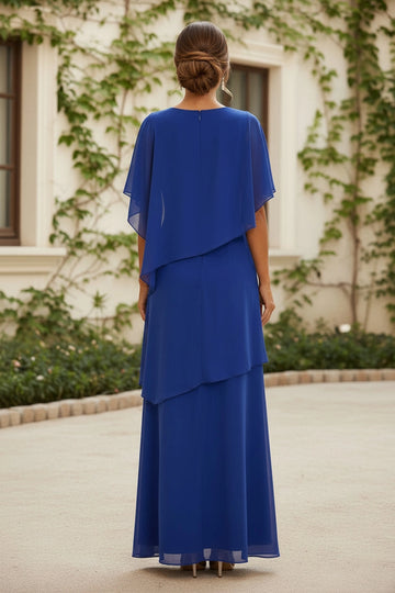 Royal blue mother of the bride gown with closed round back, center closure, sheer flutter sleeves and asymmetrical cascading chiffon-style layers, back view.