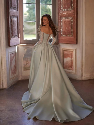 Sage green floor-length prom dress with lace back details and sweeping train
SEO Title
