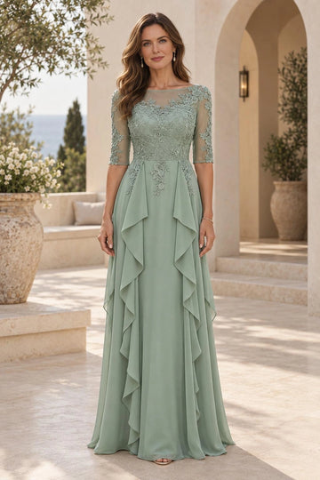 Sage green A-line mother of the bride dress with sheer illusion neckline, floral lace bodice, three-quarter sleeves and cascading side ruffles