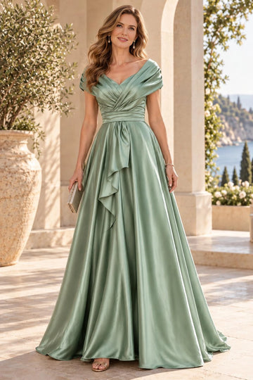 Sage green A-line mother of the bride dress with off-shoulder V-neckline, pleated bodice, defined waist, cascading front ruffles and floor-length skirt