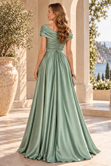 Back view of sage green mother of the bride dress featuring off-shoulder neckline, ruched lace-up-style back, waist ties and flowing A-line skirt