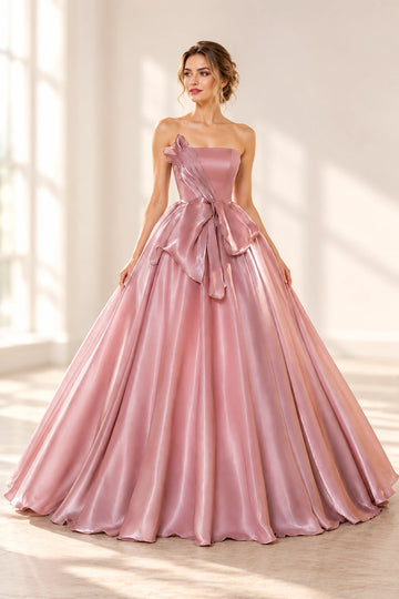 Front view of a Vedress pink satin prom ball gown with a strapless neckline, sculptural bodice detail and oversized waist bow