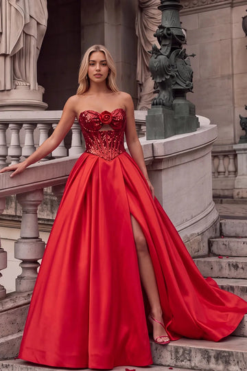 Vedress red sequin and satin A-line prom dress with a strapless sweetheart neckline, rose detail, front cutout and high leg slit.