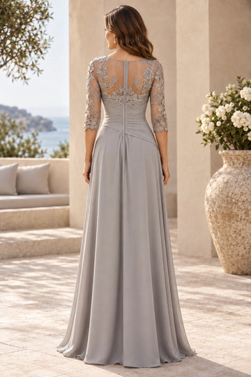 Back view of silver gray mother of the bride gown with floral lace illusion back, center zipper, ruched bodice and flowing floor-length A-line skirt