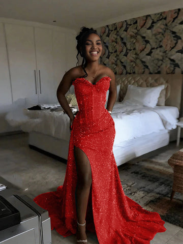 Vedress red sparkly mermaid prom dress with a strapless sweetheart neckline, corset-style bodice, high slit, and train, front view.