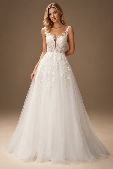 Vedress A-line wedding dress with a plunging V-neckline, floral lace straps and botanical appliqués cascading onto the skirt.