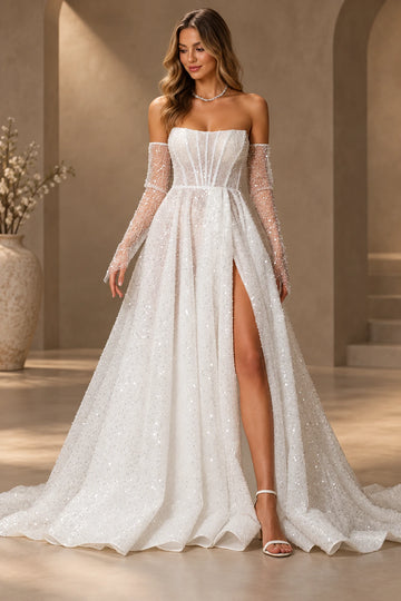 Vedress sparkling A-line wedding dress with a strapless corset-style bodice and high leg slit, styled with sheer embellished arm sleeves.