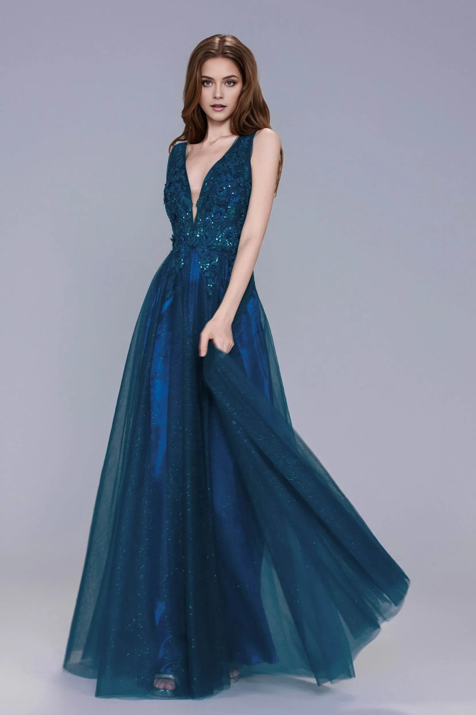 A-line evening gown with plunge V-neckline, sleeveless straps, appliqué bodice, and flowing glitter tulle skirt