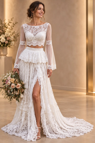 Vedress two-piece floral lace wedding dress with a bateau crop top, sheer bell sleeves and a tiered A-line skirt with a high slit, front view