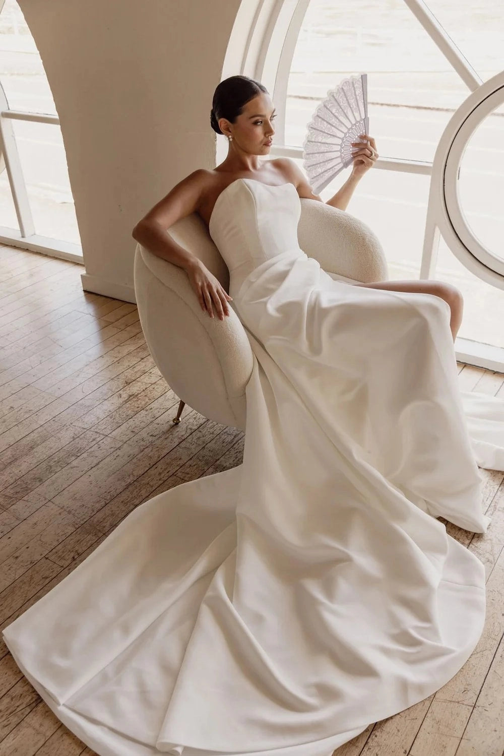 Ivory Satin Off-shoulder Sleeveless Button Back Cathedral Train Wedding Dress