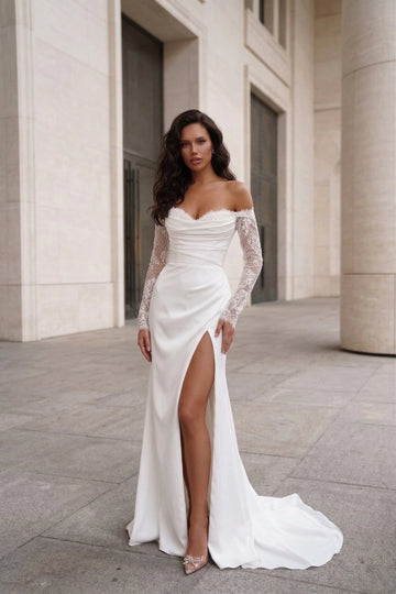 Vedress minimalist white satin off shoulder detachable lace sleeve high slit mermaid wedding dress city building front shot