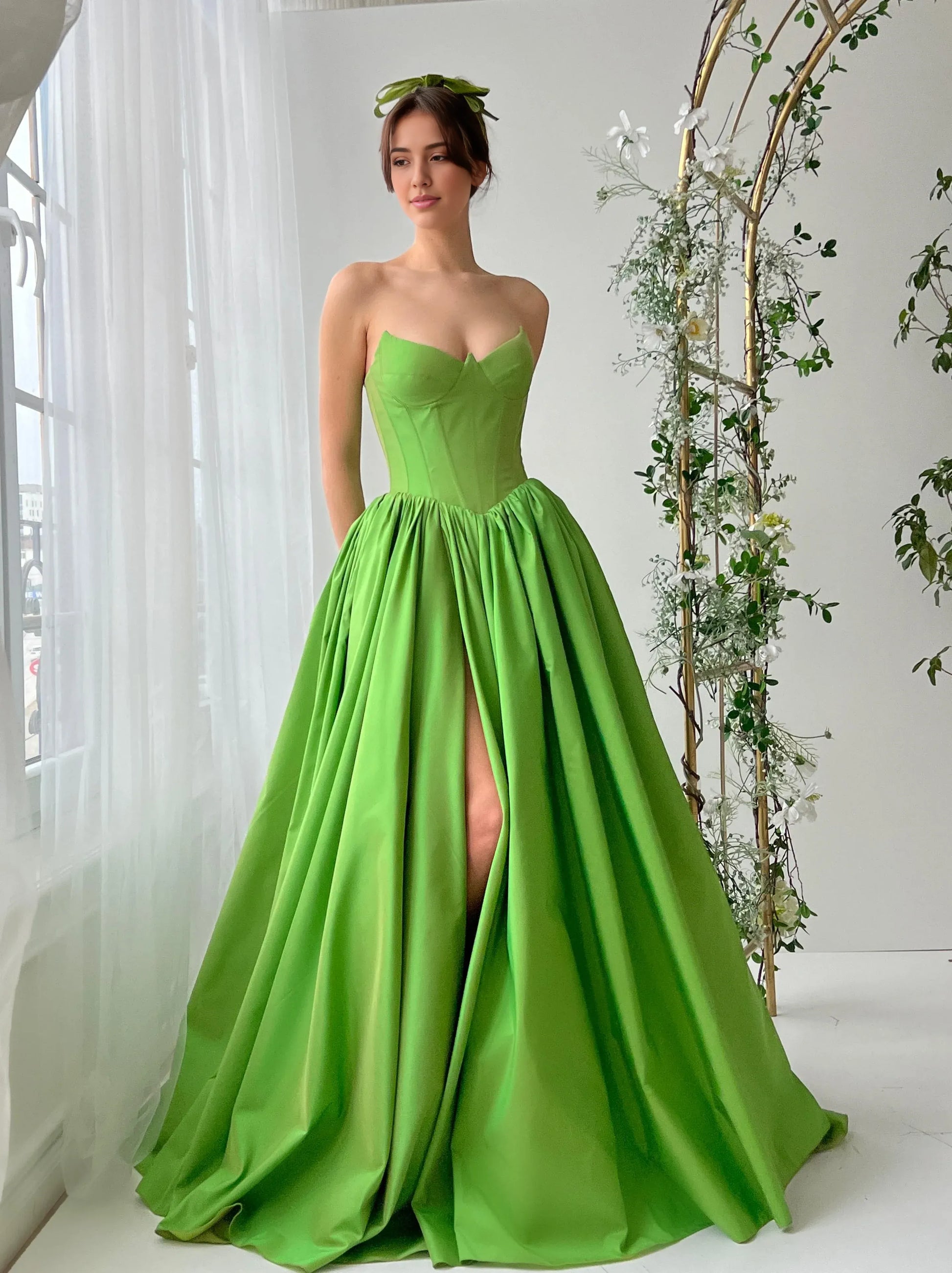 strapless sweetheart satin prom gown with structured corset bodice, full A-line skirt, and thigh-high slit