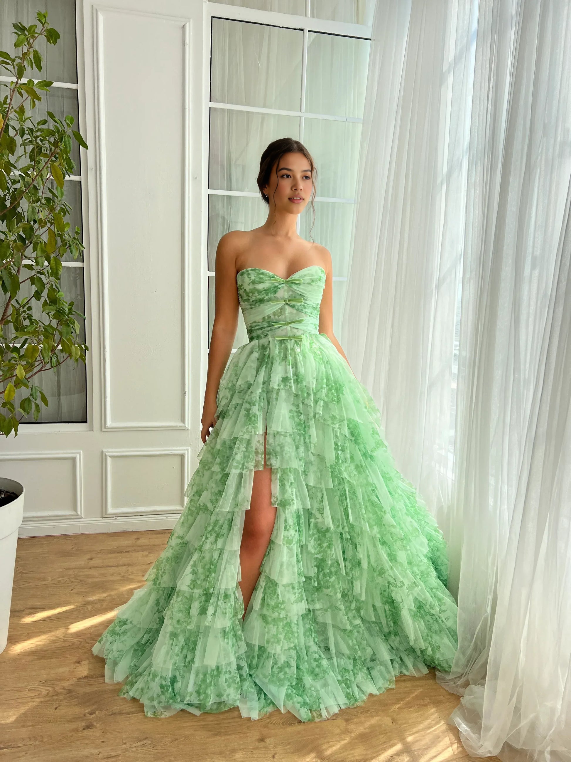 strapless sweetheart floral tulle prom gown with tiered high-low skirt and bow bodice details