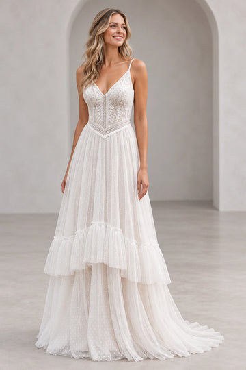 Front view of Vedress boho wedding dress with V-neck floral lace bodice, spaghetti straps and ruffled dotted tulle A-line skirt.