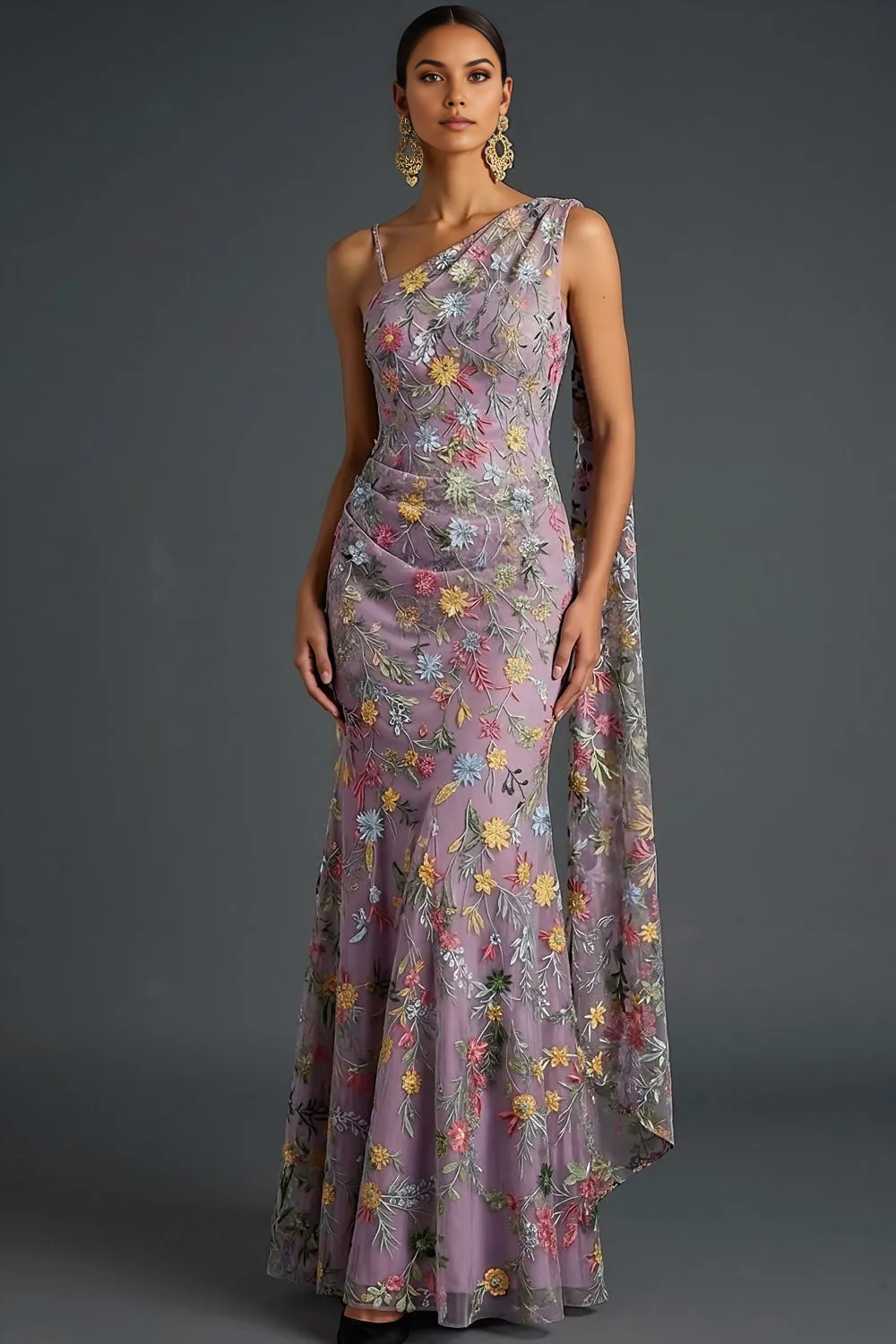 one-shoulder floral embroidered tulle evening gown with draped cape detail and mermaid silhouette