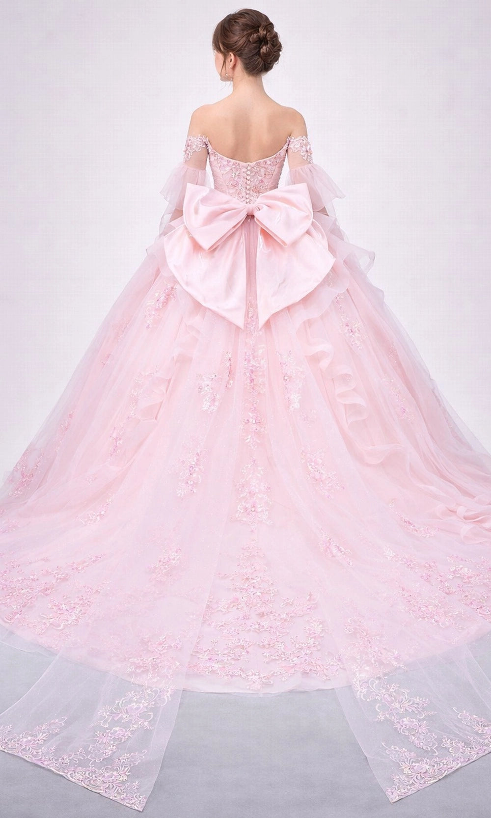 Vedress blush pink quinceanera dress corset back oversized satin bow cathedral train ruffled tulle ballgown back view