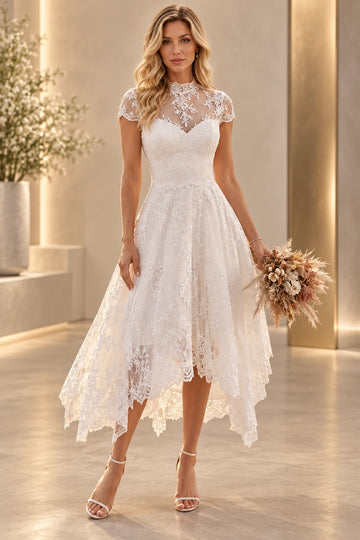 Vedress lace A-line midi wedding dress with a high illusion neckline, cap sleeves, sweetheart lining and asymmetrical scalloped hem.