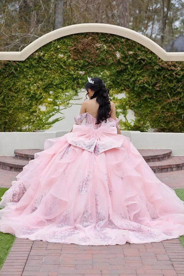 Back view Vedress pink quinceanera gown corset lace-up back oversized sequin bow layered ruffle train