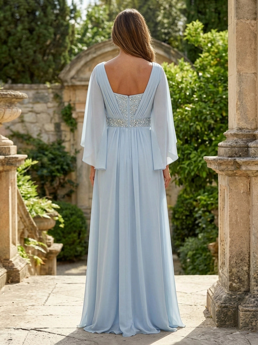 Model wearing vedress light blue a line chiffon wedding guest dress v back rhinestone detail outfit