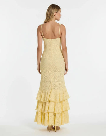 Pale yellow lace wedding guest dress with low back and layered ruffles