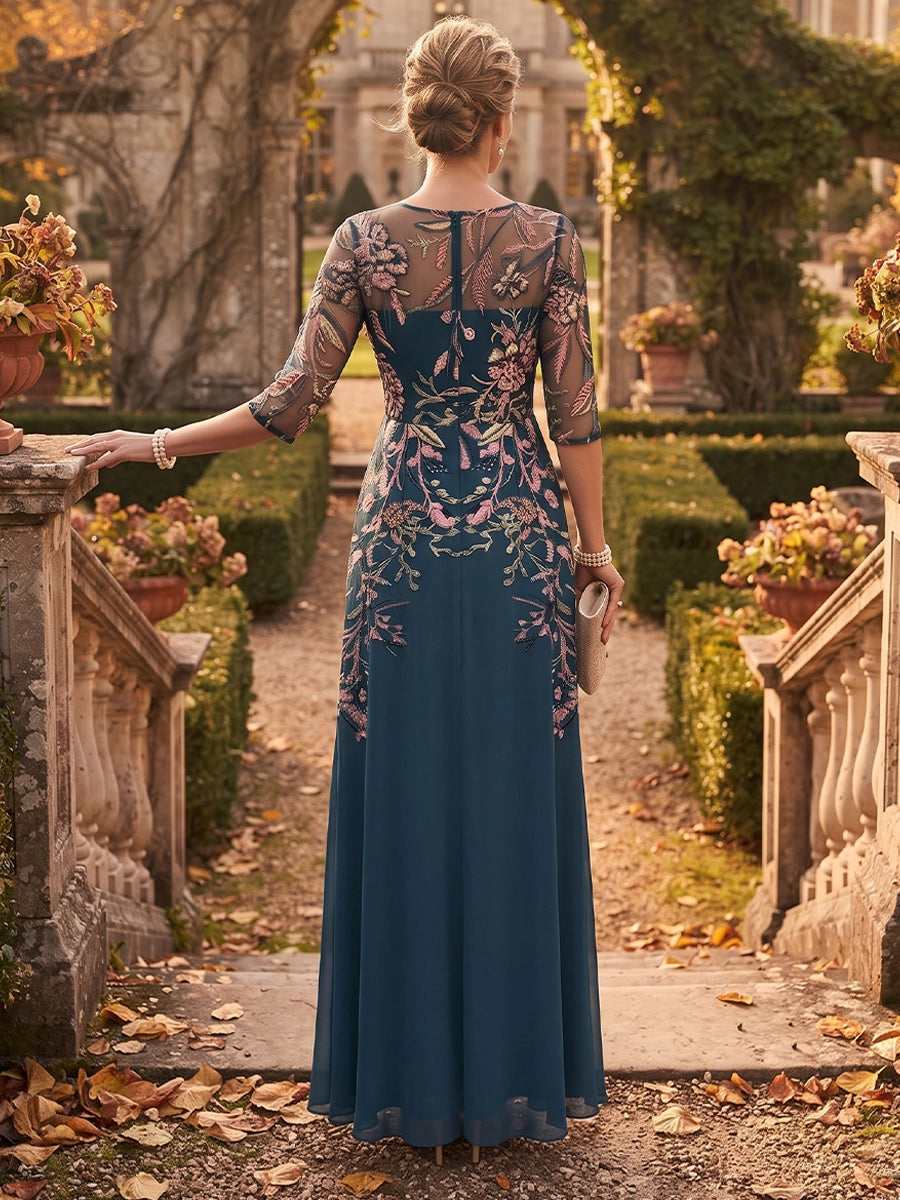 Model wearing vedress navy embroidered mother of bride dress sheer button back long formal gown rear view