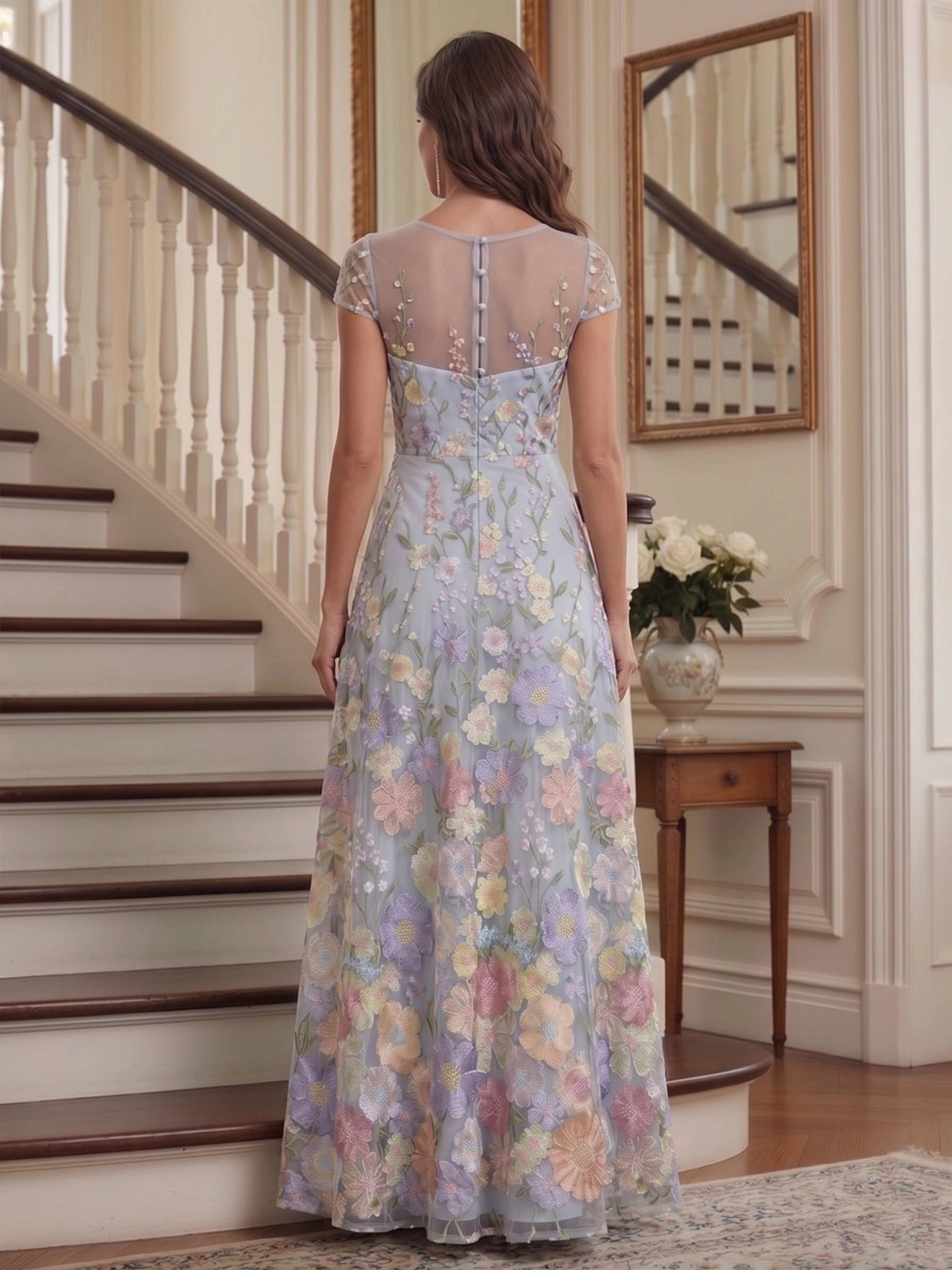 Model wearing vedress light blue floral embroidered mother of bride dress sheer button back long formal gown rear view