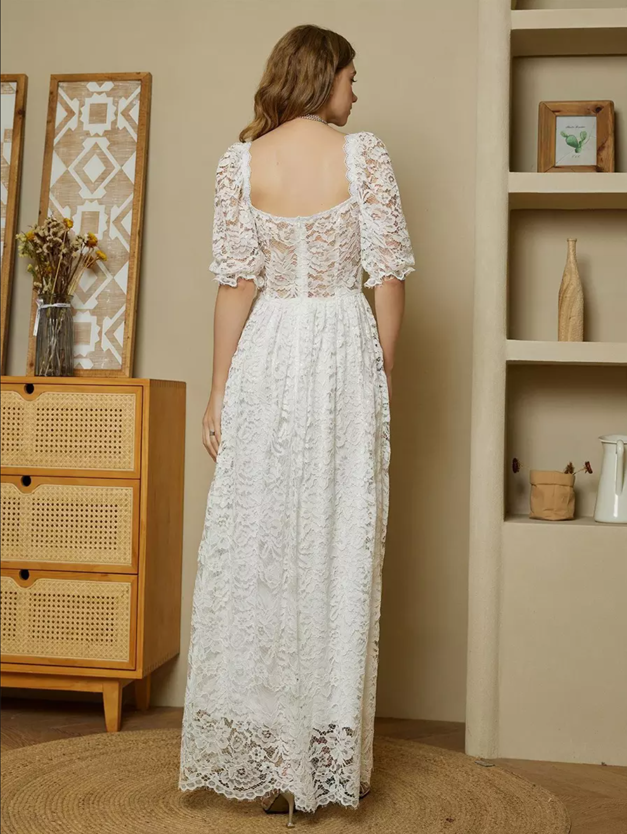 Back view of white lace formal dress with low square back, short lace sleeves, full lace skirt, and romantic A-line silhouette by VEDRESS
