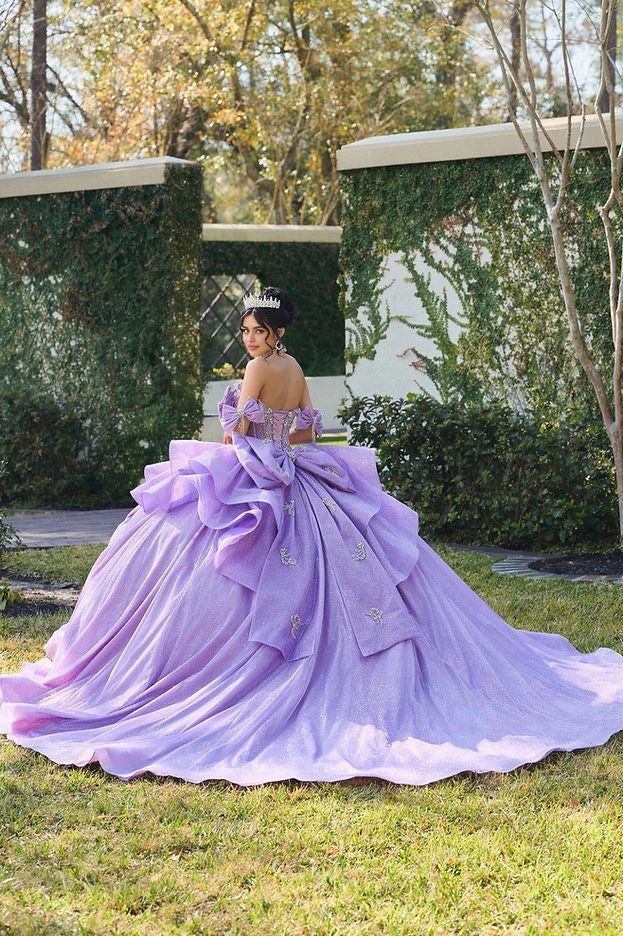 Vedress lavender quinceañera gown lace-up corset back layered oversized ruffle bow long glitter train back view