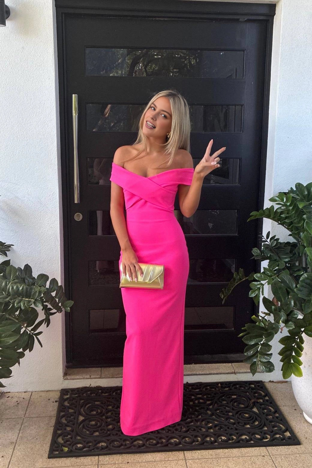 Vedress bright hot‑pink off‑shoulder cross wrapped sheath floor‑length prom dress house doorway front‑view