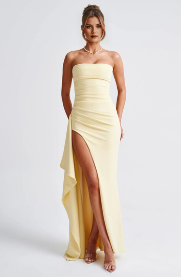 Strapless sheath bridesmaid gown with pleated bodice, high slit, side drape, and floor-length formal skirt by Vedress