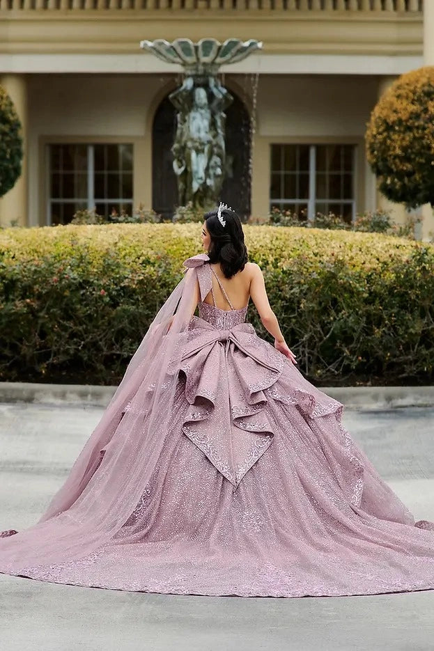 Vedress mauve quinceañera gown lace-up corset back oversized layered ruffle bow, one shoulder tulle cape, long glitter train back view