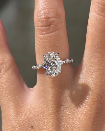 Oval Cut Engagement Ring with Round Side Stones
