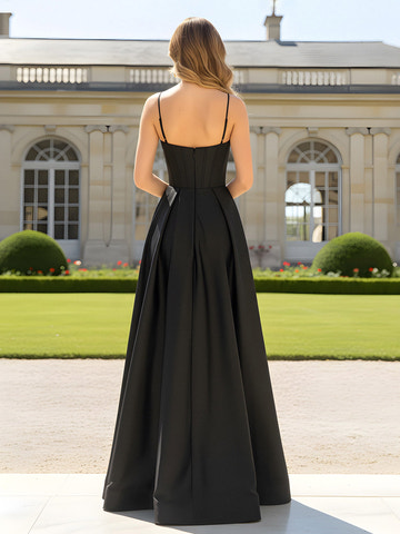 Back view of black A-line satin prom gown with low back, spaghetti straps, structured bodice, back zipper, and flowing floor length skirt by VEDRESS