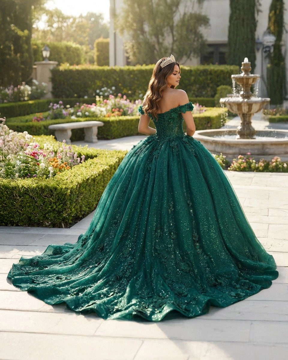 Vedress emerald green quinceanera ballgown back view, lace up corset back, glitter tulle sweep train decorated with handmade 3D flowers