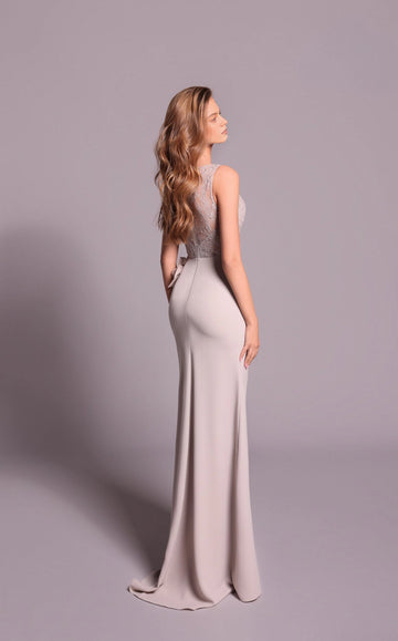 Side back view of a dusty mauve floor-length dress showing the lace-covered upper back and fitted skirt